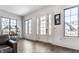 Bright entryway with hardwood floors, white door and large windows at 2301 Nowland Ave, Indianapolis, IN 46201