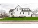 The side of the home shows off the beautifully landscaped yard and new siding at 2301 Nowland Ave, Indianapolis, IN 46201