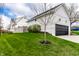 Exterior of the detached garage with black door and siding that matches the house at 2301 Nowland Ave, Indianapolis, IN 46201
