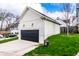 Detached two car garage with black door and siding that matches the home at 2301 Nowland Ave, Indianapolis, IN 46201