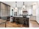 Modern kitchen with gray and white cabinets and a large island at 2301 Nowland Ave, Indianapolis, IN 46201