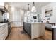 Spacious kitchen with center island, white and gray cabinetry and stainless steel appliances at 2301 Nowland Ave, Indianapolis, IN 46201
