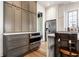 Gray kitchen cabinets with white countertops and stainless steel appliances at 2301 Nowland Ave, Indianapolis, IN 46201
