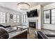 Open living space with hardwood floors, fireplace, and comfortable seating at 2301 Nowland Ave, Indianapolis, IN 46201