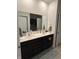 Modern bathroom with double vanity and dark cabinets at 2746 Lanai Ln, Greenwood, IN 46143