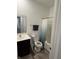 Clean bathroom with tub shower, dark vanity, and neutral floor at 2746 Lanai Ln, Greenwood, IN 46143