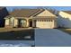 Brick ranch home with a two-car garage and landscaped lawn at 2746 Lanai Ln, Greenwood, IN 46143