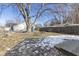 Large backyard with mature tree, shed, and deck at 305 Hamilton St, Fortville, IN 46040