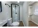 Contemporary bathroom featuring a walk-in shower, toilet and closet at 305 Hamilton St, Fortville, IN 46040
