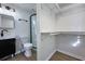 Clean bathroom with a shower, toilet and floating vanity at 305 Hamilton St, Fortville, IN 46040