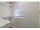 Functional closet with built-in shelving and a window for natural light at 305 Hamilton St, Fortville, IN 46040