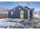 Rear view of charming house with yellow door and deck at 305 Hamilton St, Fortville, IN 46040