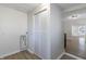 Laundry area with a built-in closet and view into the living room at 305 Hamilton St, Fortville, IN 46040