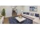 Bright living room with a plush blue rug, neutral sofa with throw pillows, and modern decor at 305 Hamilton St, Fortville, IN 46040