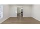 Bright living room with hardwood floors and view of kitchen at 305 Hamilton St, Fortville, IN 46040