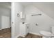 Compact bathroom offers essential fixtures and a functional layout; doorway to the left at 3102 N Arsenal Ave, Indianapolis, IN 46218