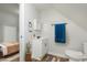 Cozy bathroom with white single sink vanity, patterned rug, and modern fixtures at 3102 N Arsenal Ave, Indianapolis, IN 46218