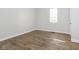 Bright bedroom with hardwood flooring and a window allowing for natural light at 3102 N Arsenal Ave, Indianapolis, IN 46218