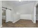 Bright room with dark wood floors features a sliding barn door and fresh white paint at 3102 N Arsenal Ave, Indianapolis, IN 46218