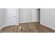Well-lit bedroom featuring hardwood flooring and a spacious closet at 3102 N Arsenal Ave, Indianapolis, IN 46218