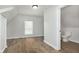 Cozy room boasts warm wood-look flooring and a window letting in plenty of natural light at 3102 N Arsenal Ave, Indianapolis, IN 46218