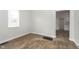 Bright bedroom features new wood-look floors, fresh paint, and plenty of natural light at 3102 N Arsenal Ave, Indianapolis, IN 46218