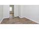Inviting bedroom boasts stylish wood-look floors and is freshly painted in a neutral color at 3102 N Arsenal Ave, Indianapolis, IN 46218