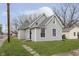 Charming home featuring gray siding, a well-maintained lawn, and a classic architectural design at 3102 N Arsenal Ave, Indianapolis, IN 46218