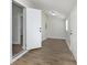 Hallway with hardwood floors leads to multiple rooms, including a mirrored closet at 3102 N Arsenal Ave, Indianapolis, IN 46218