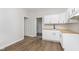 Bright kitchen featuring white cabinets, wood countertops, and hardwood flooring at 3102 N Arsenal Ave, Indianapolis, IN 46218