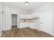 Well-lit kitchen features white cabinets, butcher block countertops, and new wood-look floors at 3102 N Arsenal Ave, Indianapolis, IN 46218