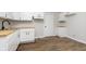 The kitchen features white cabinets, wood countertops, and hardwood flooring at 3102 N Arsenal Ave, Indianapolis, IN 46218