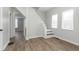 Open living area highlights staircase, wood-look floors, and fresh paint throughout at 3102 N Arsenal Ave, Indianapolis, IN 46218