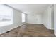 Bright living room featuring hardwood floors, fresh paint, and natural light from the windows at 3102 N Arsenal Ave, Indianapolis, IN 46218