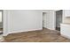 Open-concept living room with hardwood flooring and a view to an adjacent room at 3102 N Arsenal Ave, Indianapolis, IN 46218