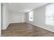 Sunlit living room showcases beautiful wood-look floors and freshly painted walls at 3102 N Arsenal Ave, Indianapolis, IN 46218