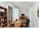 Functional office space with wood desk, leather chair, and ample storage for productivity at 3102 N Arsenal Ave, Indianapolis, IN 46218