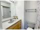 Bathroom featuring a single sink vanity with a shower/tub and decorative shower curtain at 5183 Fairway Dr, Avon, IN 46123