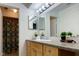 Well-lit bathroom vanity with a single sink, neutral countertop, and wood cabinets at 5183 Fairway Dr, Avon, IN 46123