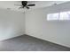 Carpeted bedroom with ceiling fan and a window for natural light at 5183 Fairway Dr, Avon, IN 46123