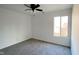 Carpeted bedroom featuring a ceiling fan and window at 5183 Fairway Dr, Avon, IN 46123