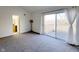 Spacious bedroom featuring neutral carpet, a vaulted ceiling, and sliding glass doors at 5183 Fairway Dr, Avon, IN 46123
