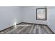 Cozy bedroom with natural light, hardwood floors, and a view of the outdoors at 5183 Fairway Dr, Avon, IN 46123