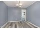Dining area with simple lighting, neutral wall paint, and hardwood flooring at 5183 Fairway Dr, Avon, IN 46123