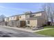 A view of a multi-level home with tan siding and a well-kept yard at 5183 Fairway Dr, Avon, IN 46123