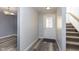 Inviting foyer with sleek floors, fresh paint, and a staircase at 5183 Fairway Dr, Avon, IN 46123