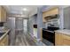 Well-lit kitchen featuring stainless steel appliances, ample counter space, and modern design elements at 5183 Fairway Dr, Avon, IN 46123