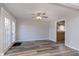 Open room with gray walls, wood floors, and a ceiling fan at 5183 Fairway Dr, Avon, IN 46123