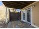 The patio area features a colorful outdoor rug and access to the home through a sliding glass door at 5183 Fairway Dr, Avon, IN 46123