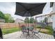 Deck with patio set and umbrella for outdoor dining at 57 Sebring Ct, Whiteland, IN 46184